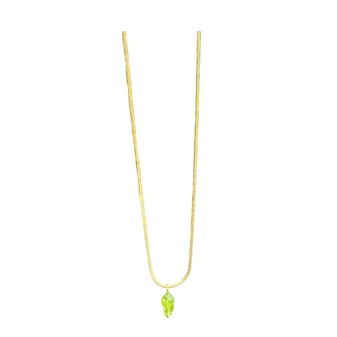 Peridot necklace featuring a sparkling green gemstone pendant on a delicate chain