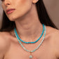 woman wearing a blue opal necklace with an Amazonite Charm