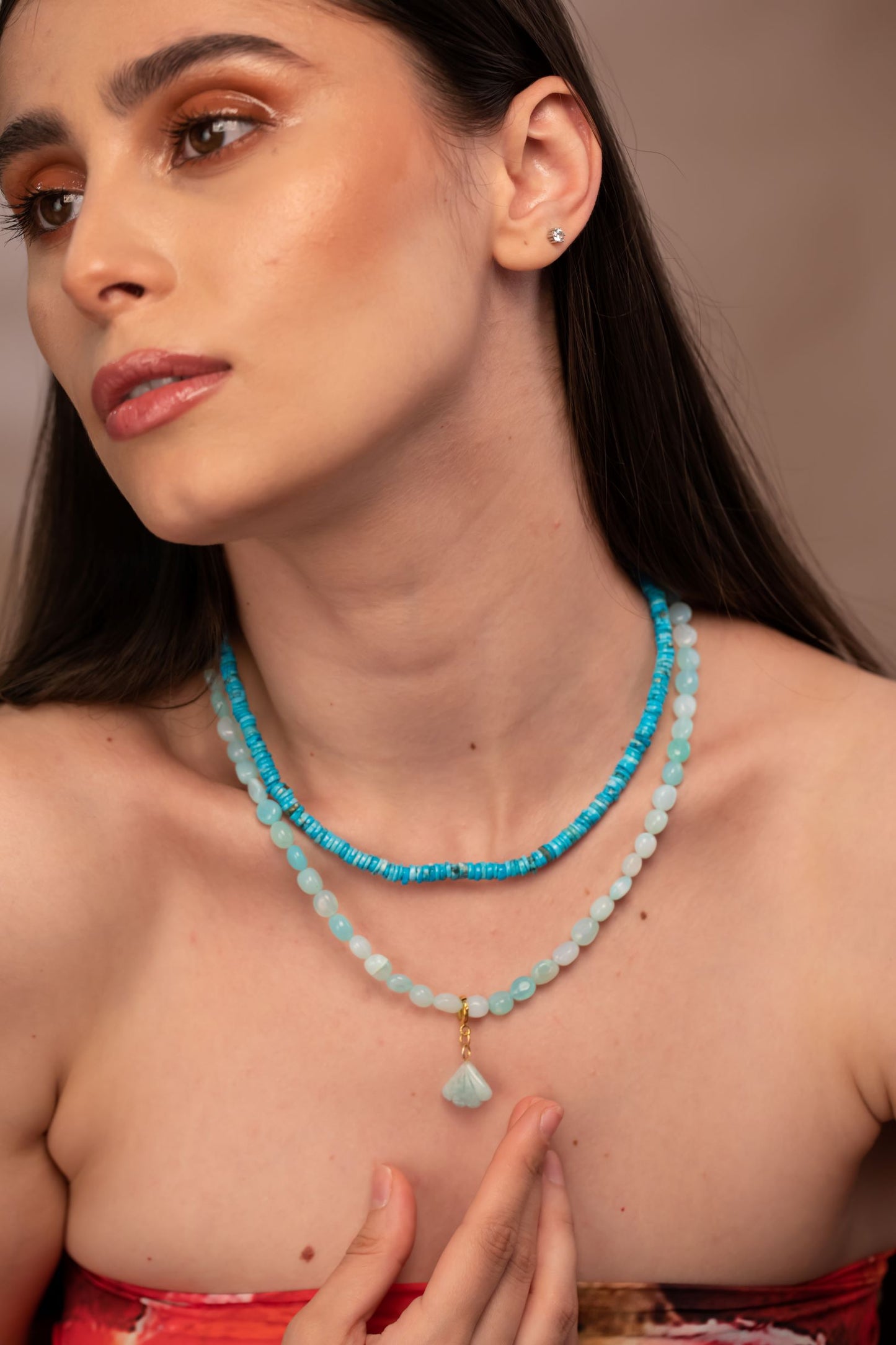 woman wearing a blue opal necklace with an Amazonite Charm