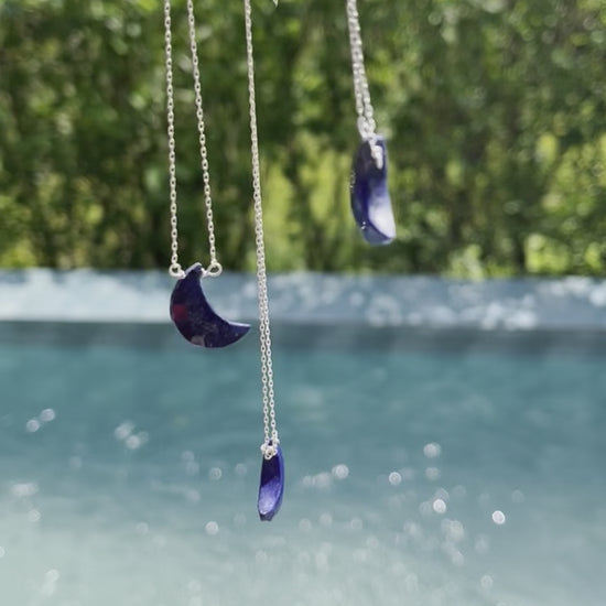 Half moon lapis lazuli necklace with a deep blue crescent shaped stone