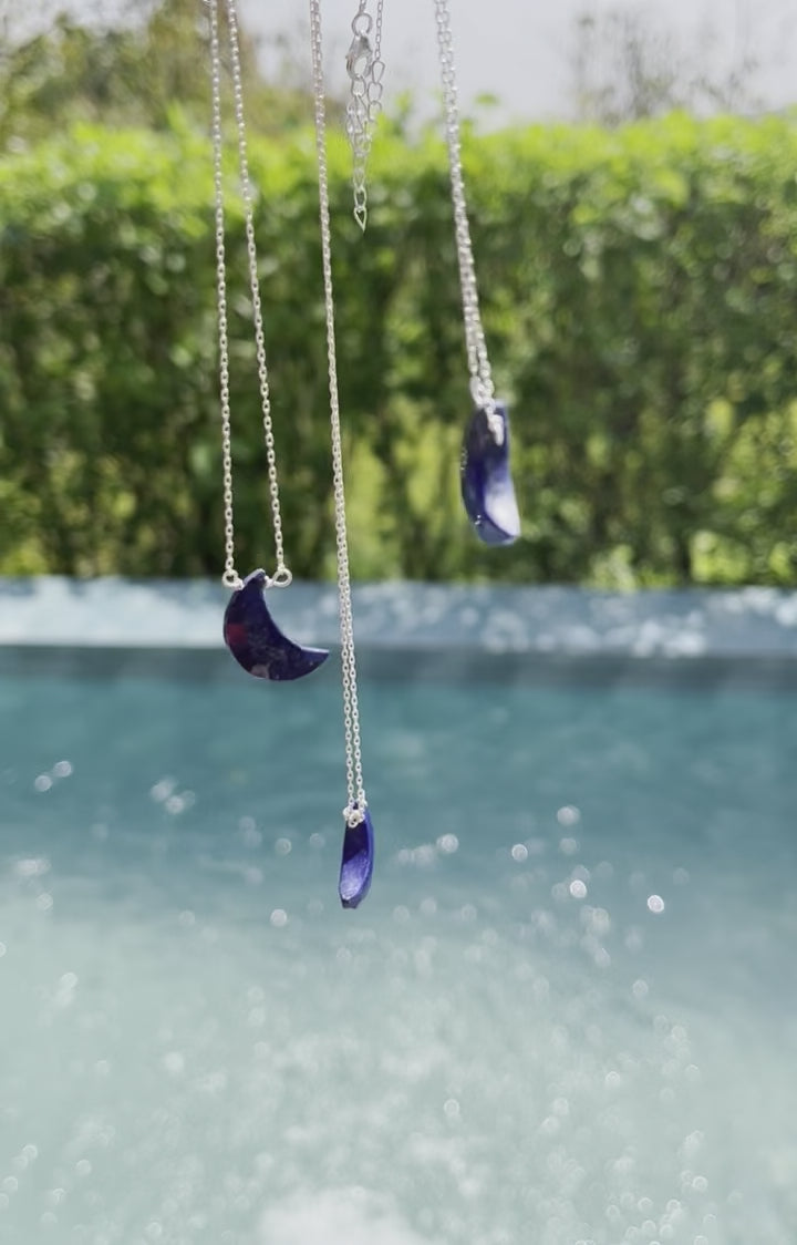 Half moon lapis lazuli necklace with a deep blue crescent shaped stone